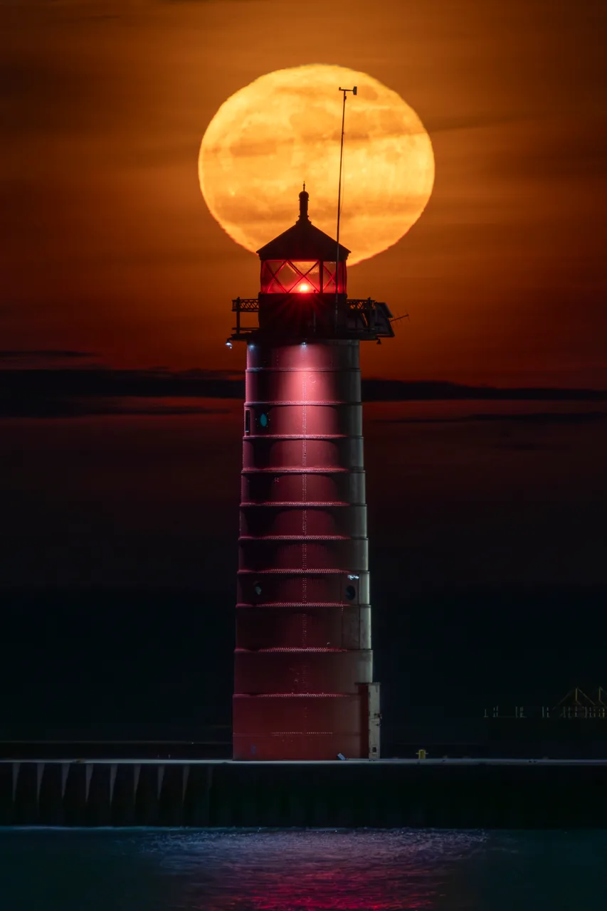 Blazing Blue Moon Over North Pier Lighthouse — A blue moon rising behind Kenosha's red North Pier Lighthouse